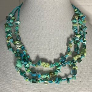 Pretty blue turquoise colored necklace with shells